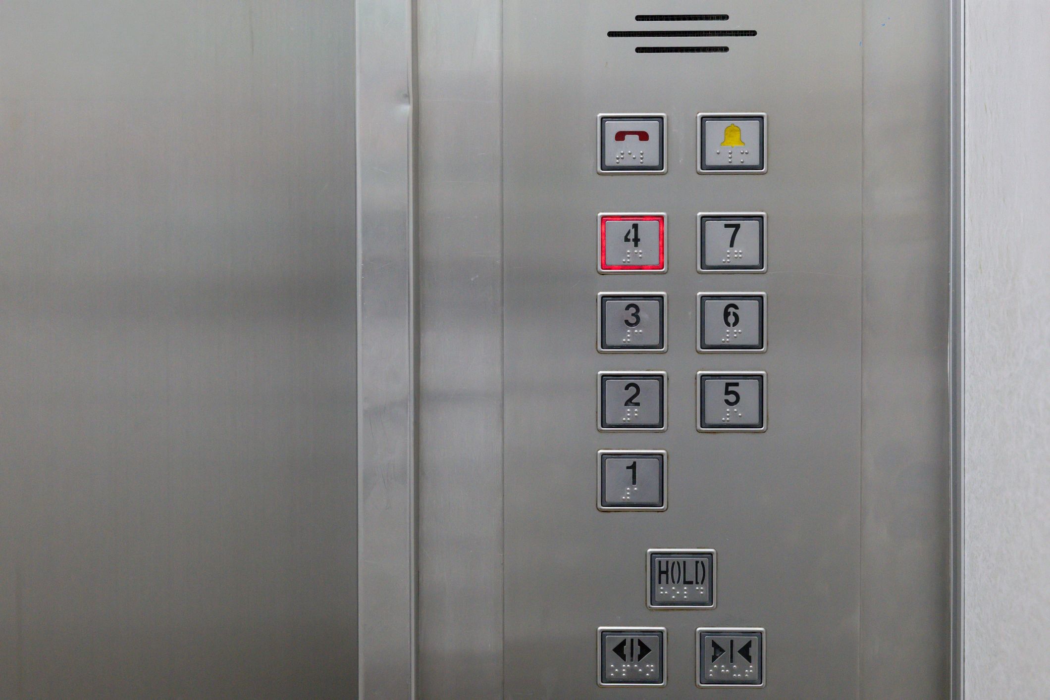 Elevator control panel with braille buttons